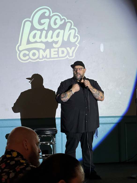Comedian performing at Go Laugh Comedy night at Ballyhoos