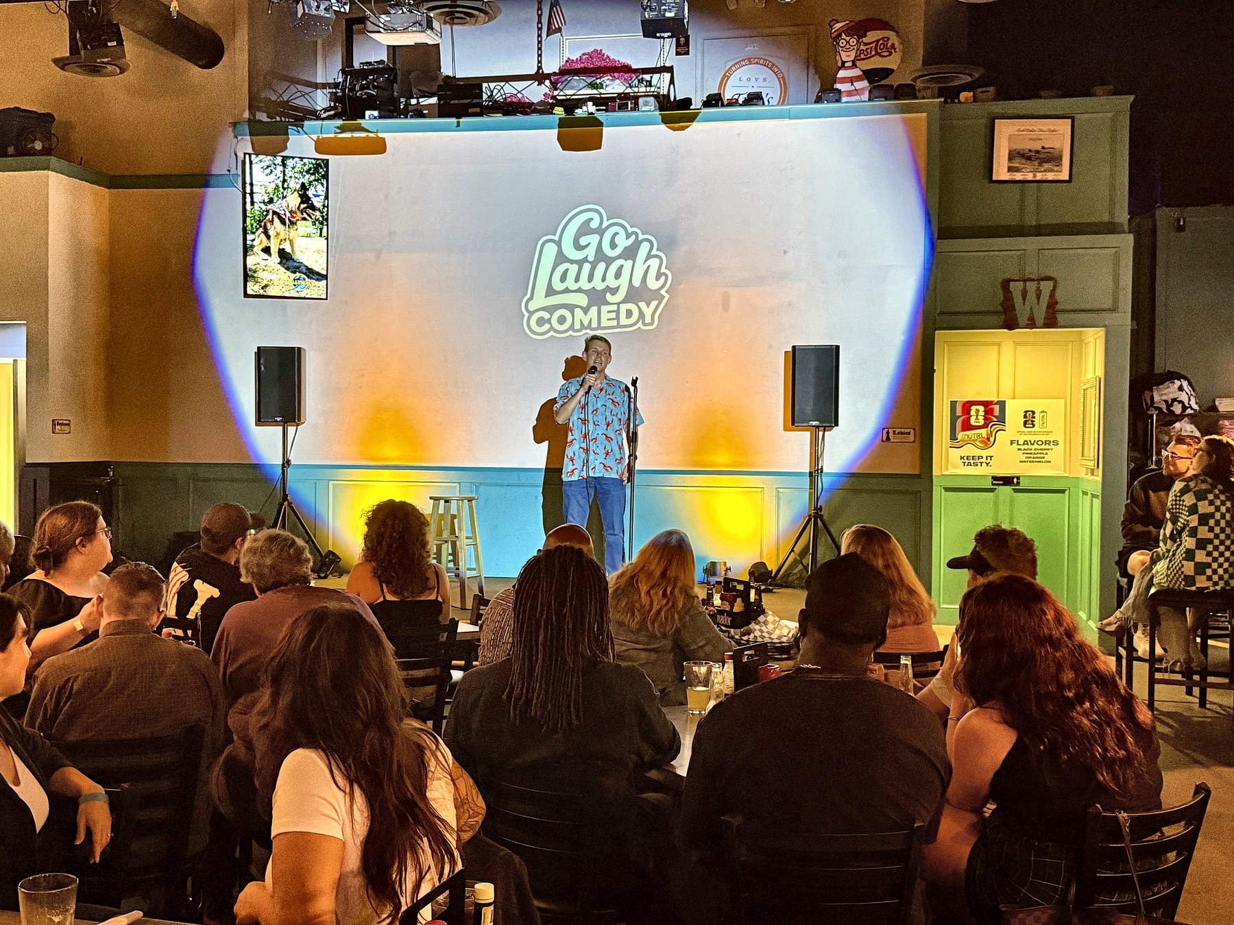 Comedian performing for the crowd at Ballyhoos
