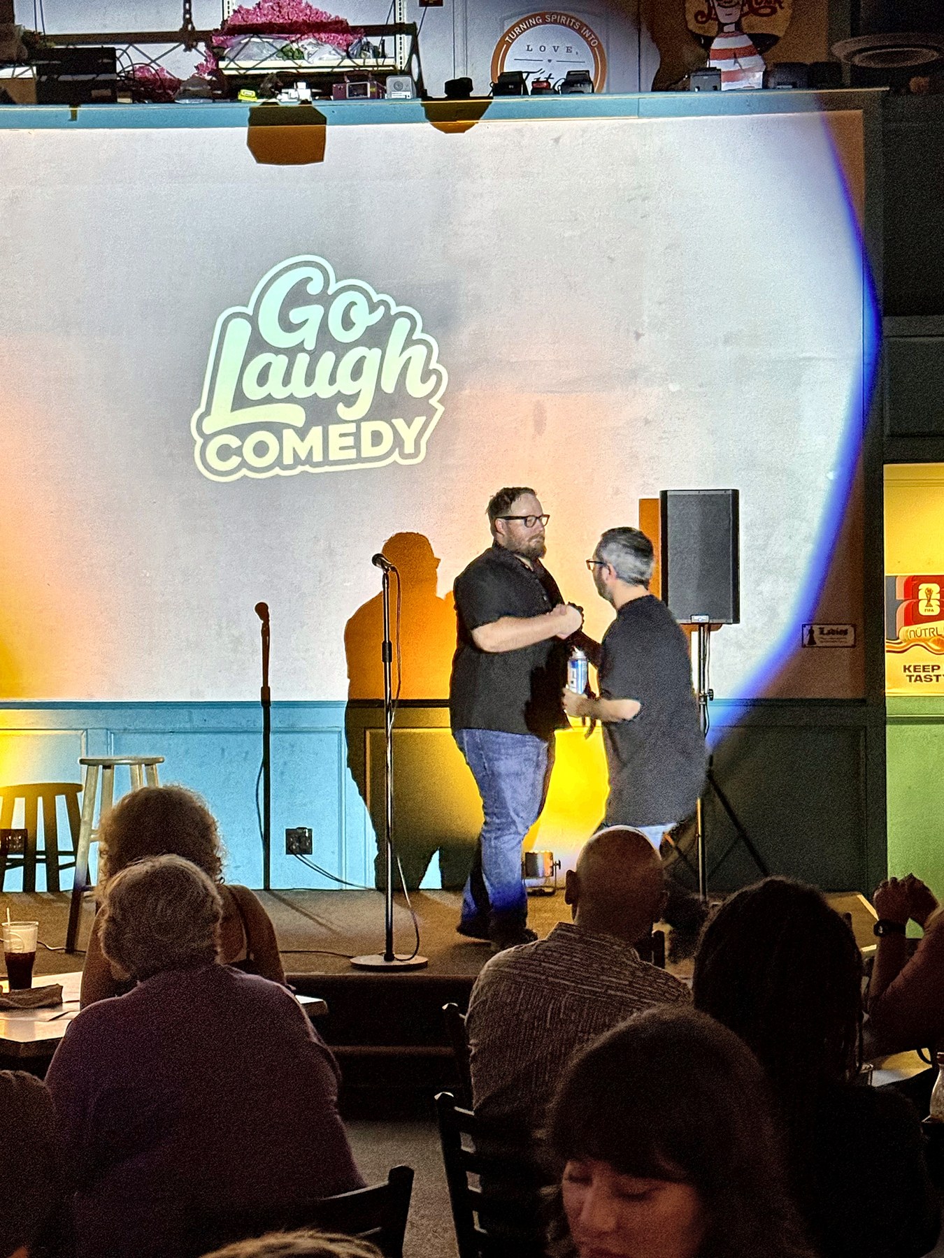 Comedians posing together on stage at Ballyhoos