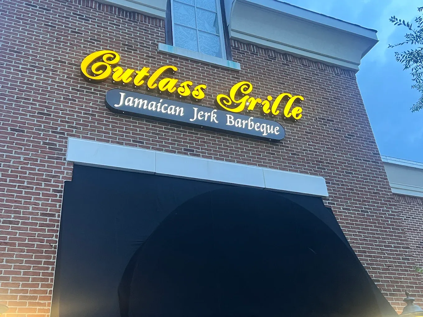 The Cutlass Grille sign — Jamaican Jerk Barbeque