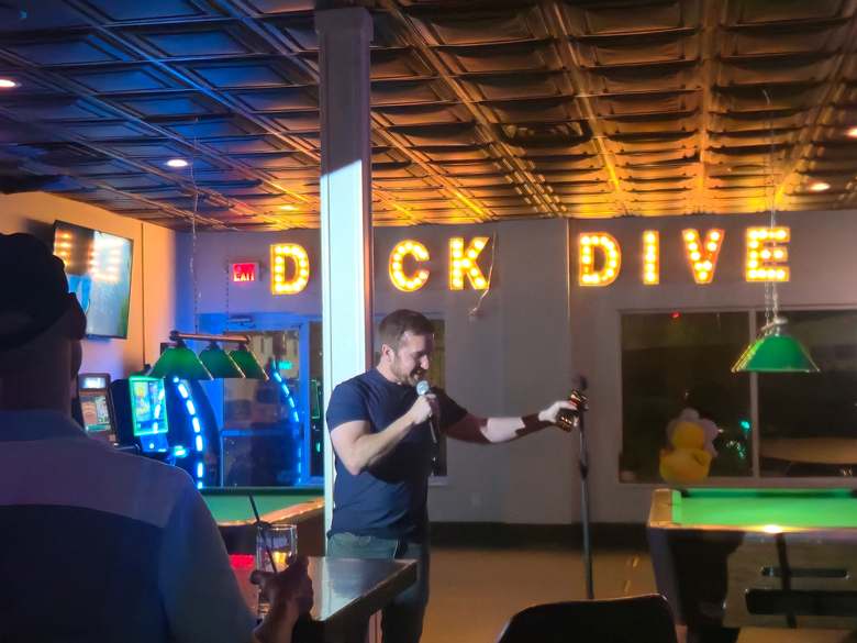 Comedian mid-bit at the Duck Dive open mic