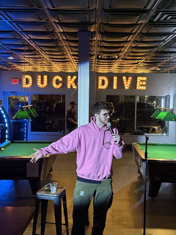 Comedian performing at Duck Dive Tavern open mic