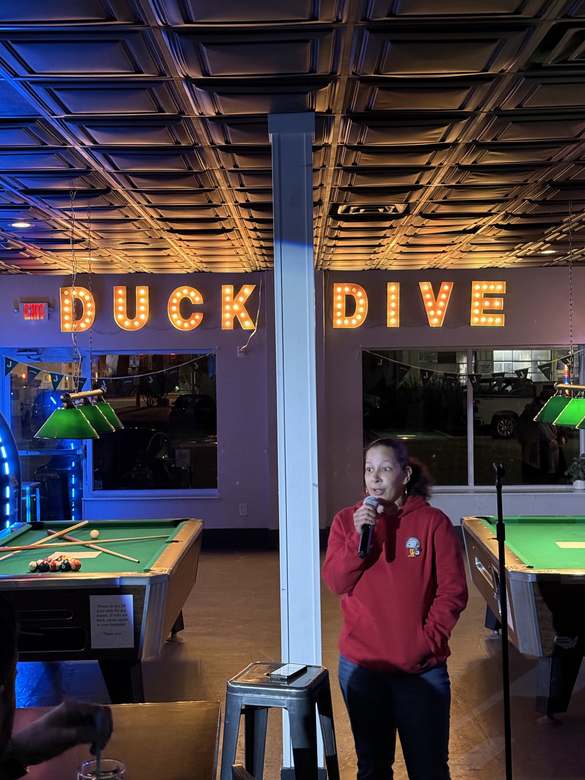 Comedian performing at Duck Dive Tavern open mic