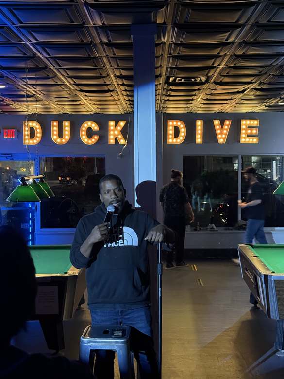 Comedian performing at Duck Dive Tavern open mic