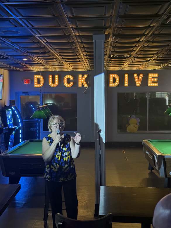 Comedian performing at Duck Dive Tavern open mic