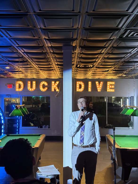 Comedian performing at Duck Dive Tavern open mic