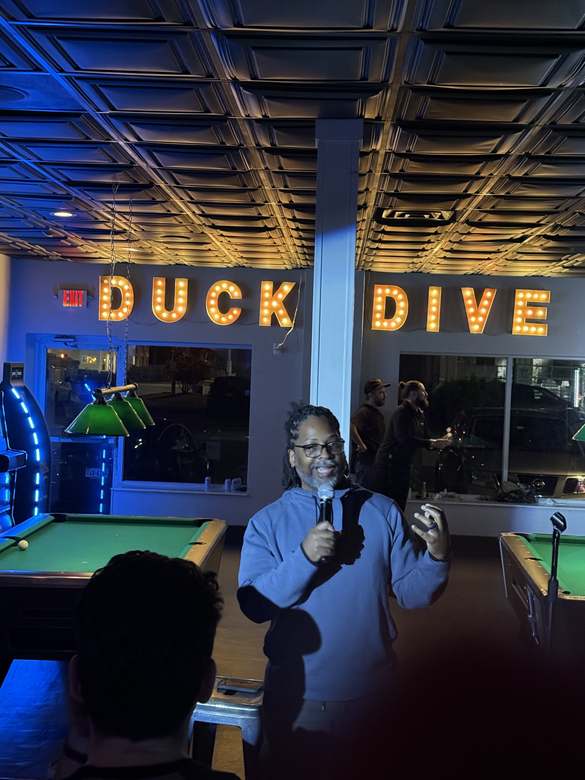 Comedian performing at Duck Dive Tavern open mic