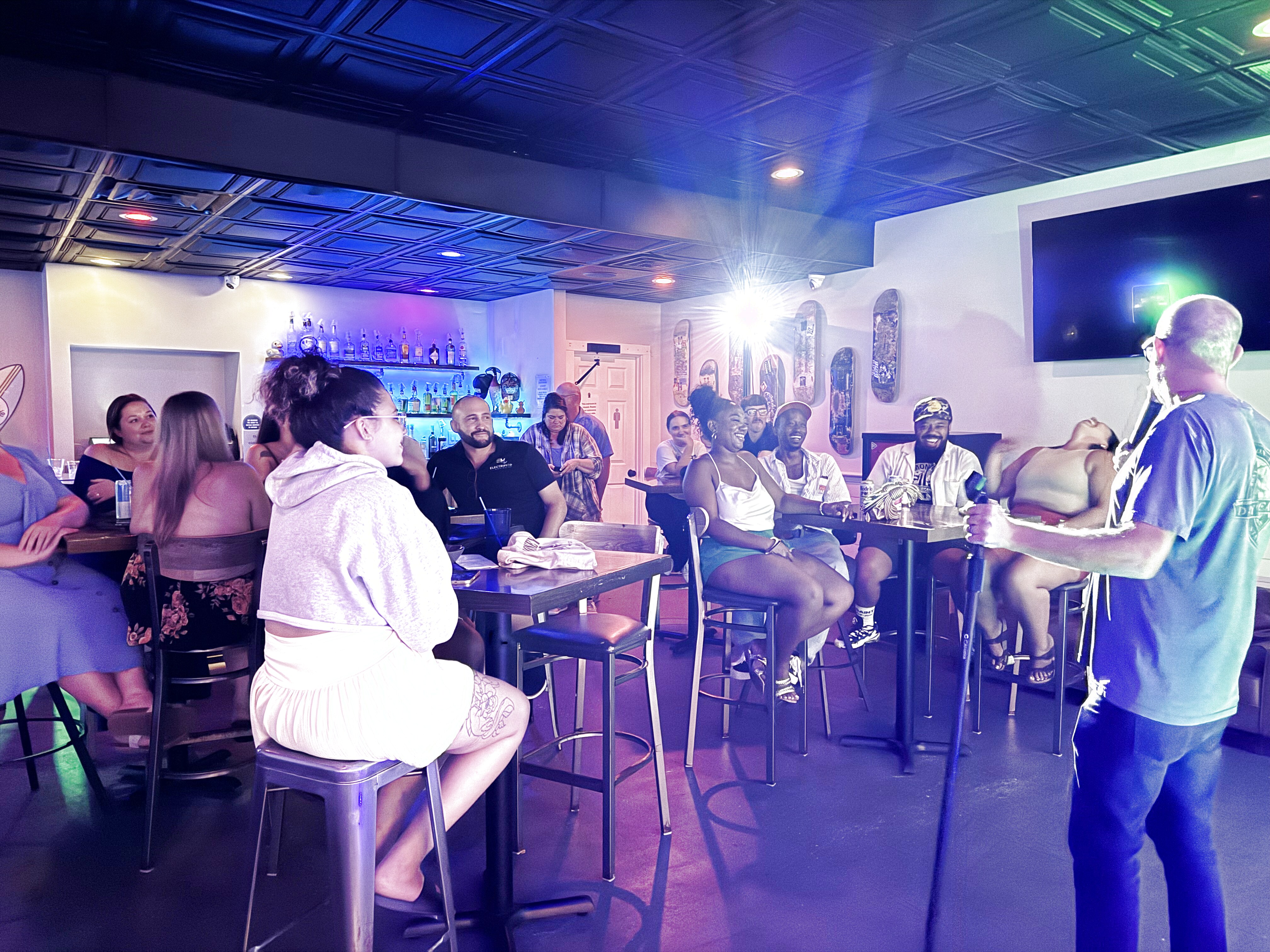 Comedian performing at Duck Dive Tavern open mic