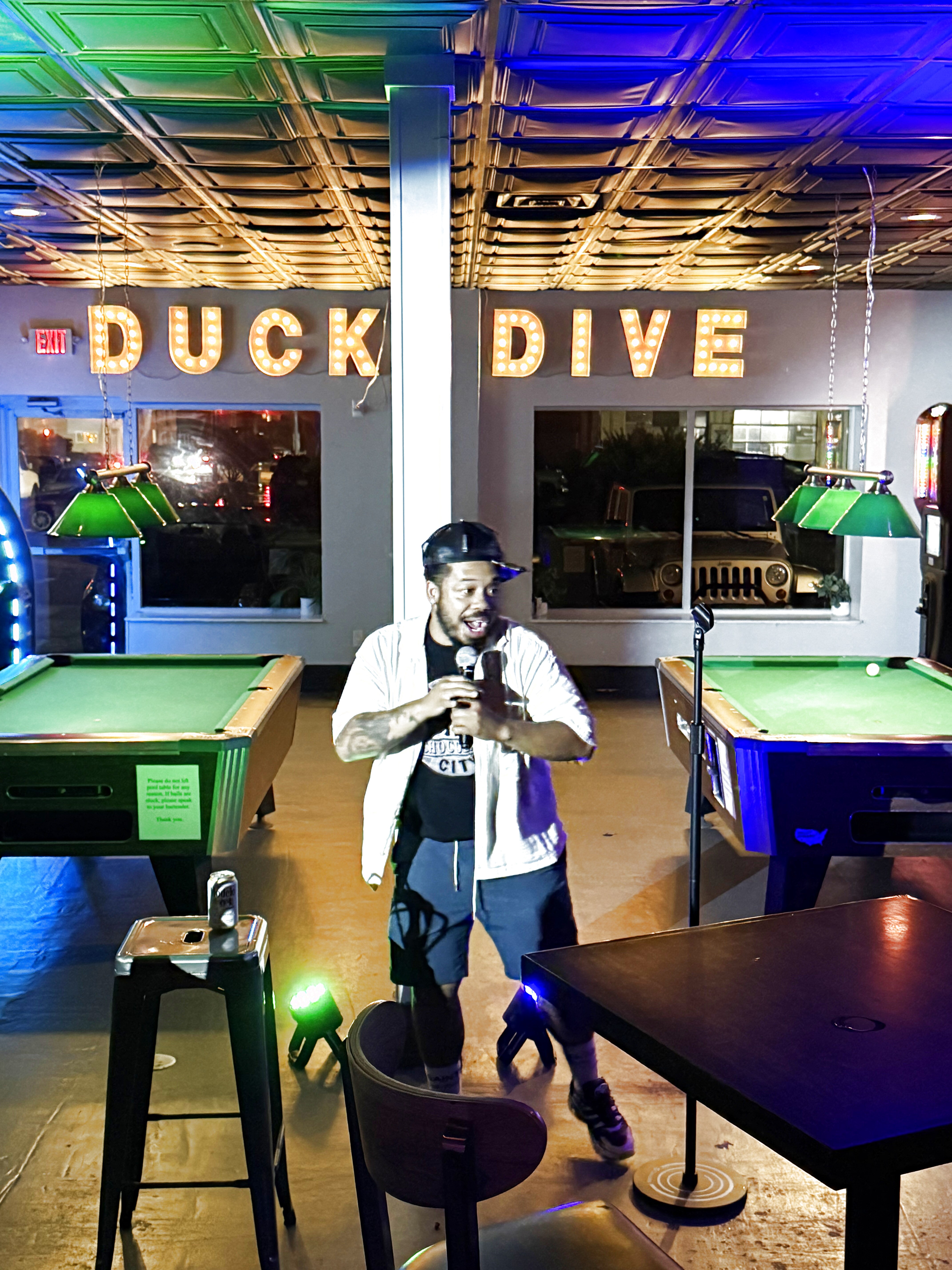 Comedian performing at Duck Dive Tavern open mic