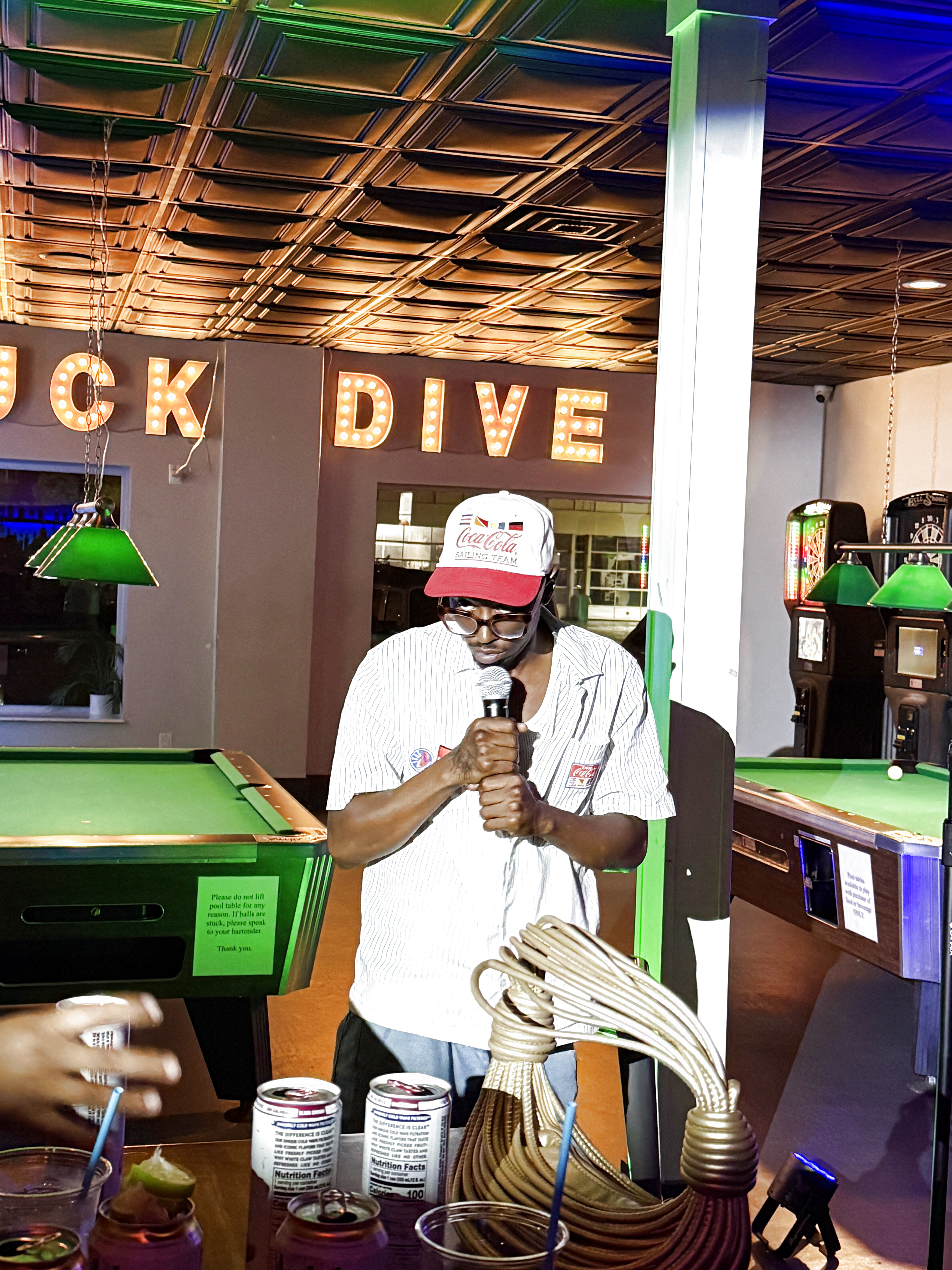 Comedian performing at Duck Dive Tavern open mic