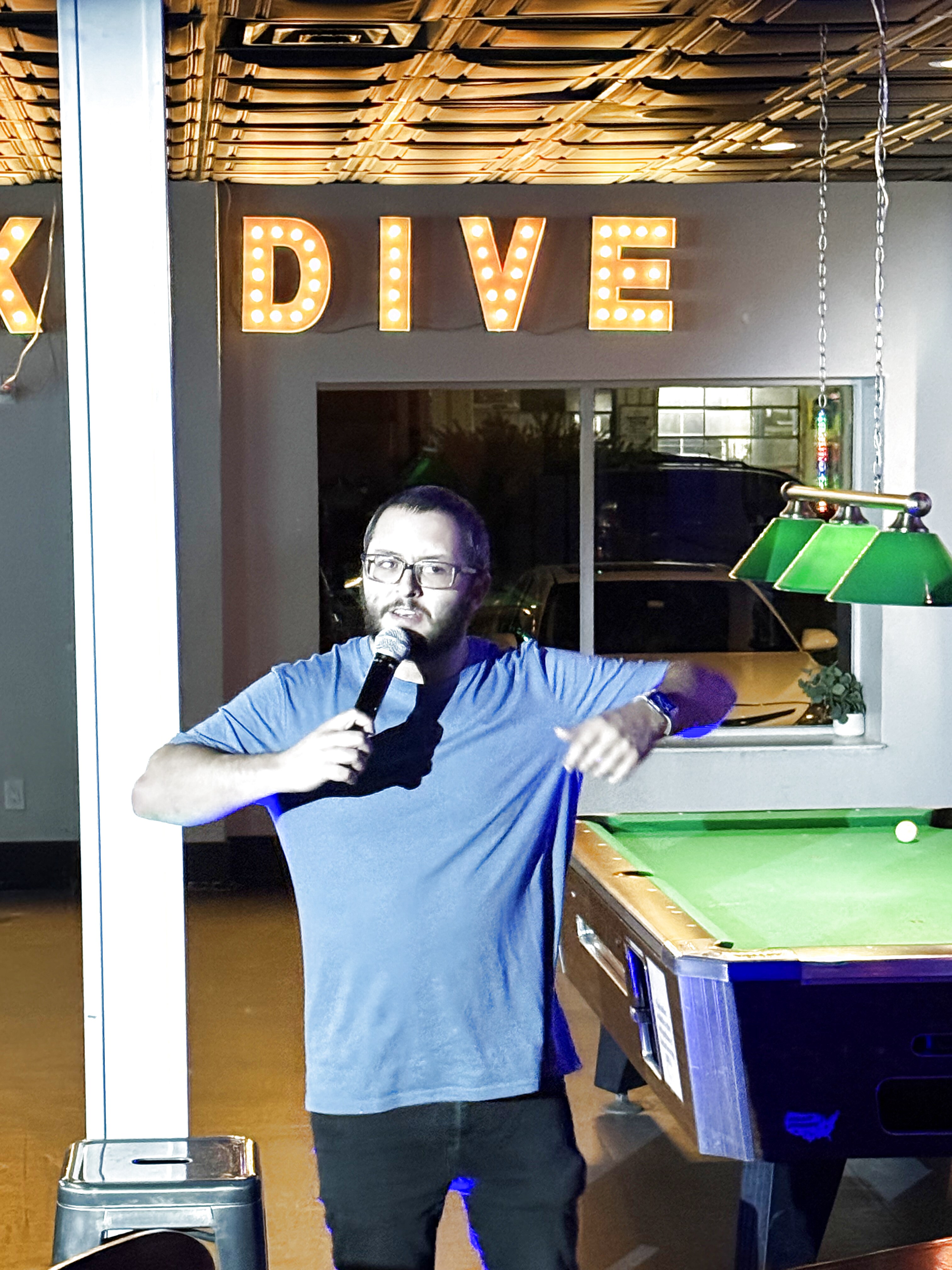 Comedian performing at Duck Dive Tavern open mic