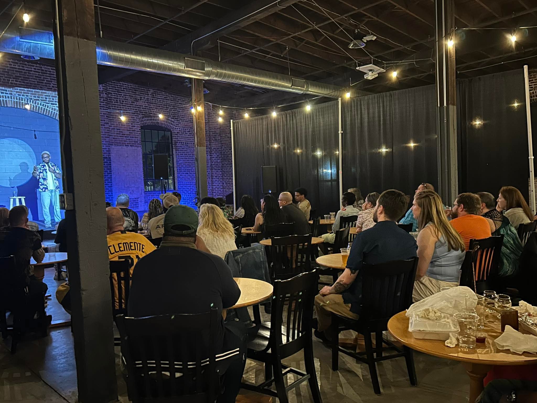 Crowd watching a Go Laugh Comedy show at Maker's Craft Brewery